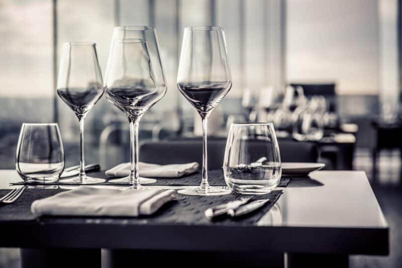 four wine glasses on a restaurant table