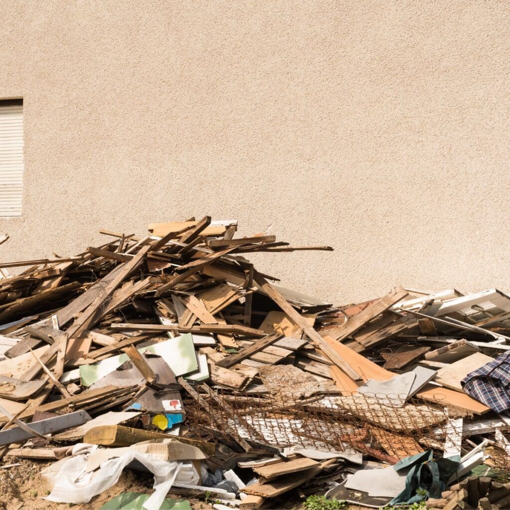 large pile of broken pieces of wood, metal, and other debris