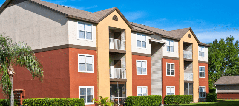 exterior of orange and white apartment buildings