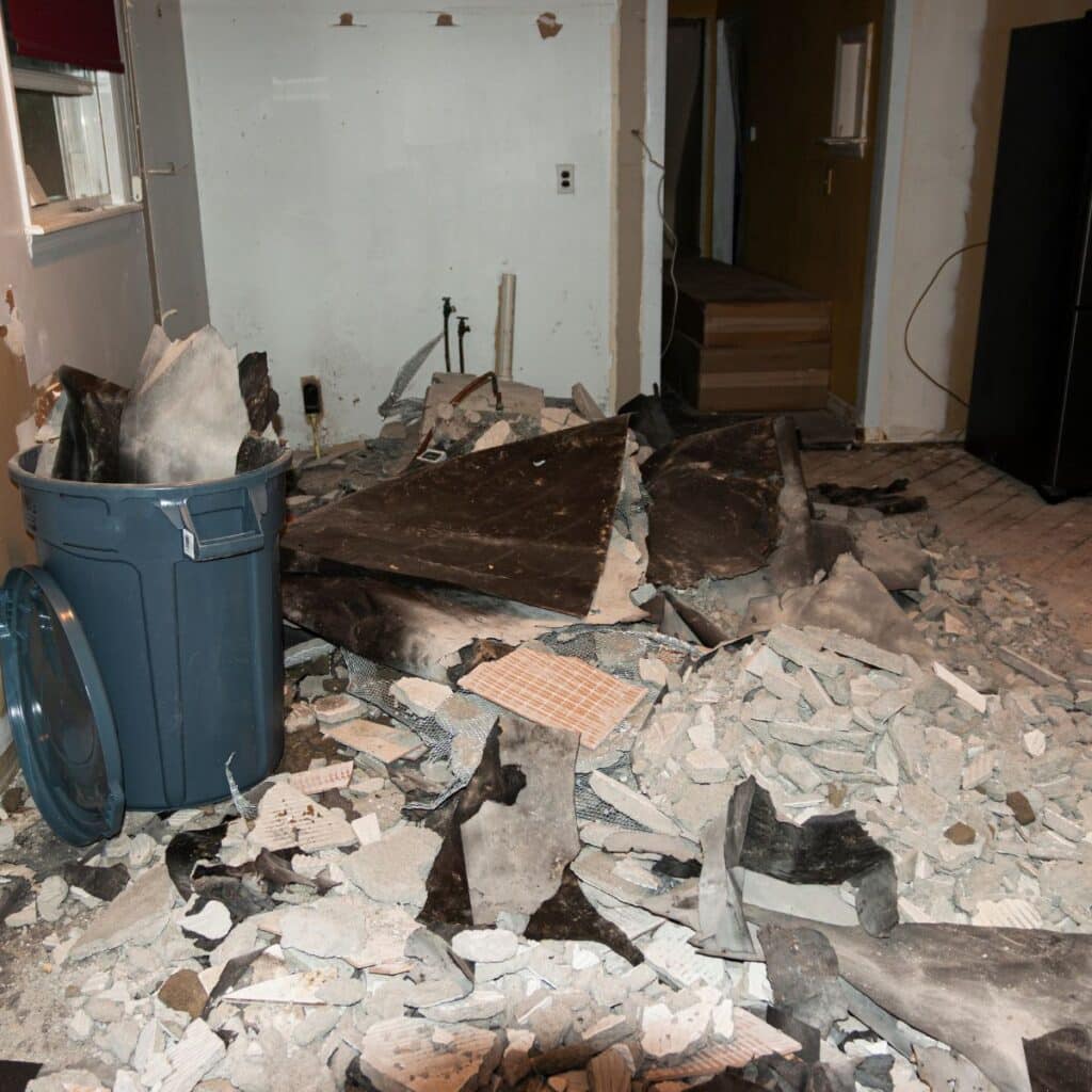 pile of broken concrete inside an old home