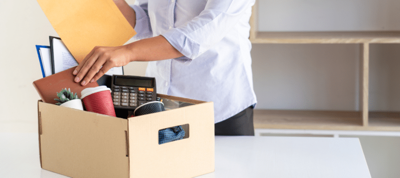 man packing things into a box